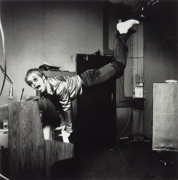 Terry O'Neill, Elton John Performing a Handstand, 1972
